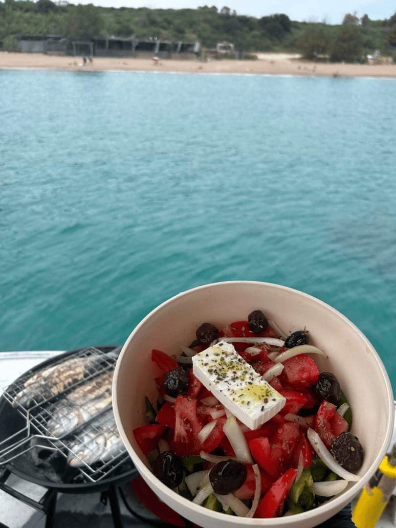 Fresh fish BBQ served onboard a Rhodes fishing trip